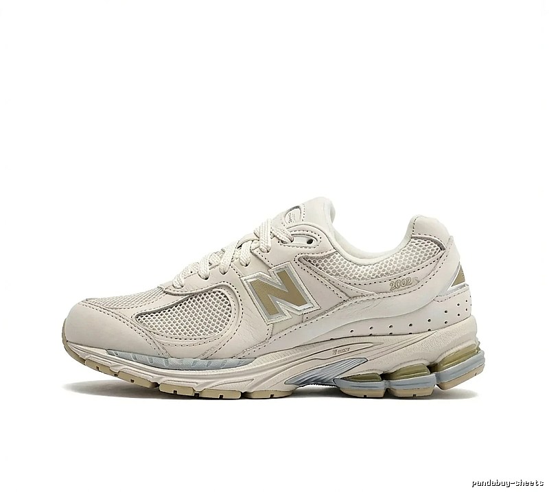 New Balance retro-style off-white sports shoes