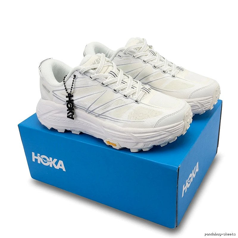 HOKA retro-style white sports shoes